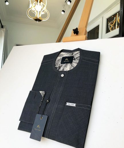 An Irish Grey Kaftan with a clear view of Swarovski button detailing