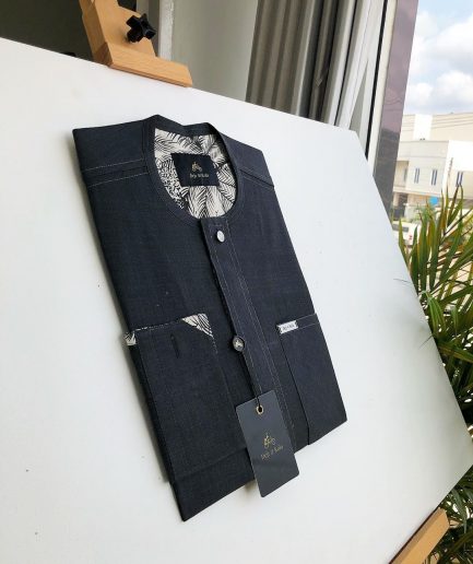 An Irish Grey Kaftan with a clear view of Swarovski button detailing