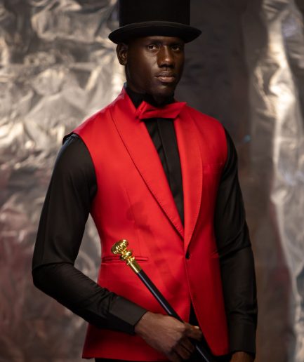 A Charcoal Black Tail Tuxedo Peal Lapel Tuxedo Suit and red Armless One Button Jacket