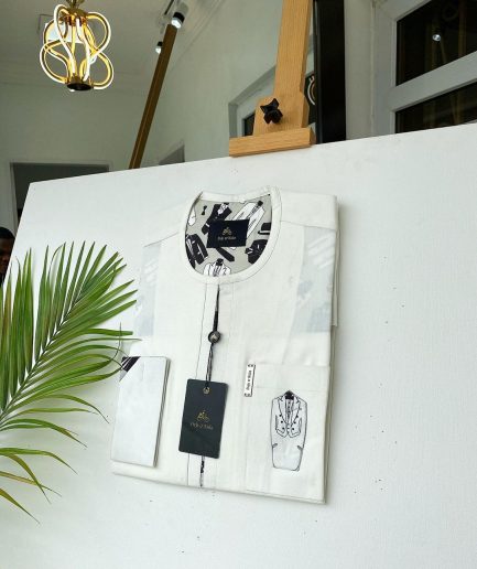 An Ivory white invisible front flap African Kaftan with Paisley Detailing