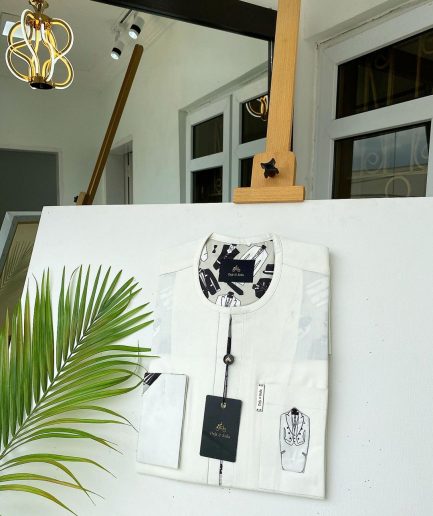 An Ivory white invisible front flap African Kaftan with Paisley Detailing