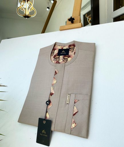 A Dark cream african kaftan With Paisley detailing