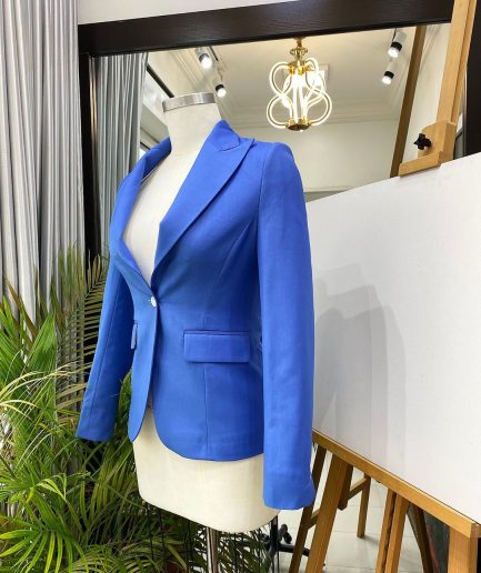 A Skye blue “Lady From Portland” Peak lapel business suit