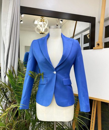 A Skye blue “Lady From Portland” Peak lapel business suit