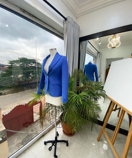 A Skye blue “Lady From Portland” Peak lapel business suit