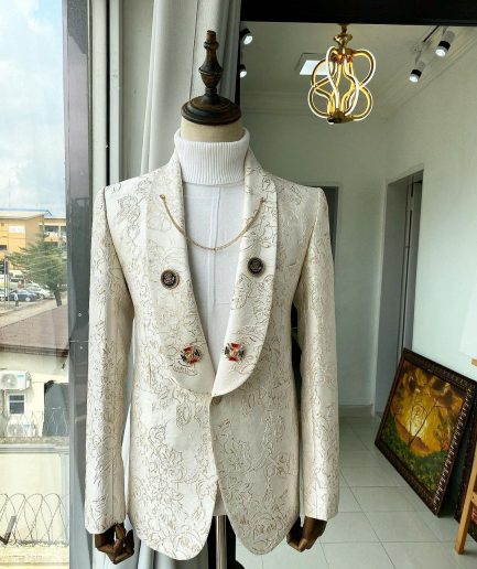 An Ivory Gold Patterned “From The Same Side” Shawl lapel Suit.
