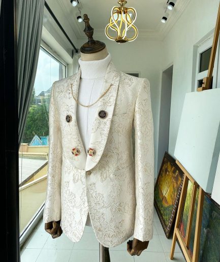 An Ivory Gold Patterned “From The Same Side” Shawl lapel Suit.