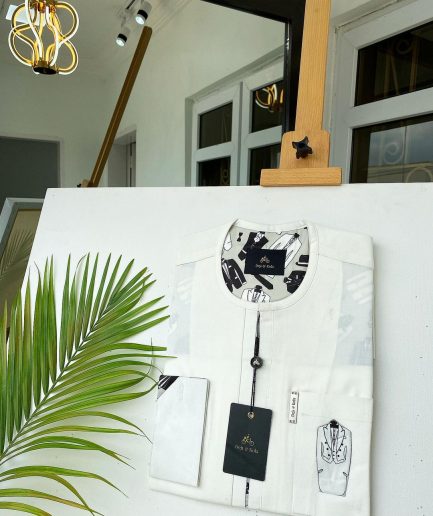An Ivory white with front flap, paisley detailing African Kaftan and sokoto