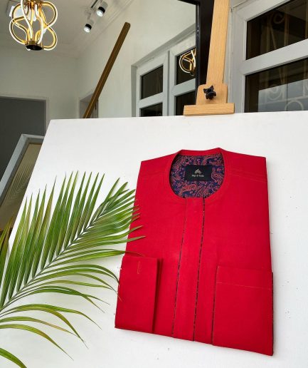 A Tomato Red Kaftan, With mixed blue and red paisley detailing and sokoto