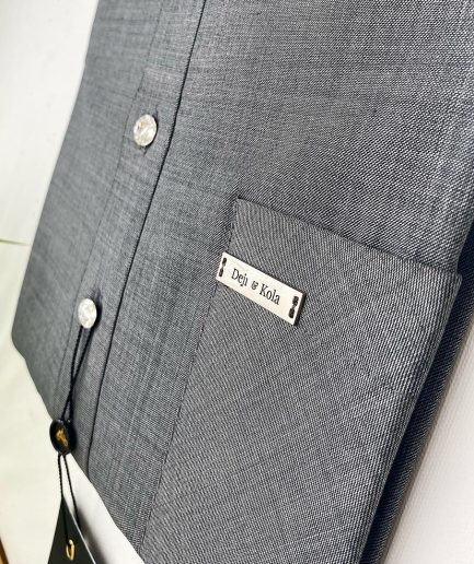 An Irish Grey African Kaftan with ABV diamond-shaped Australian Swarovski button