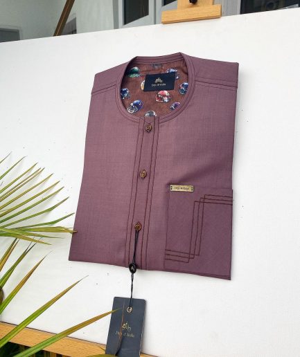 A Brown onion-coloured kaftan with brown coconut shell button detailing, paisley details