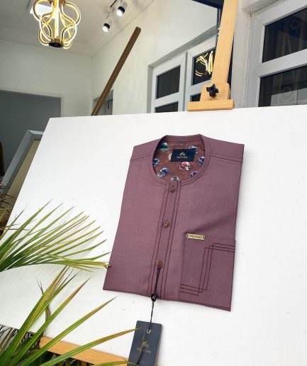 A Brown onion-coloured kaftan with brown coconut shell button detailing, paisley details