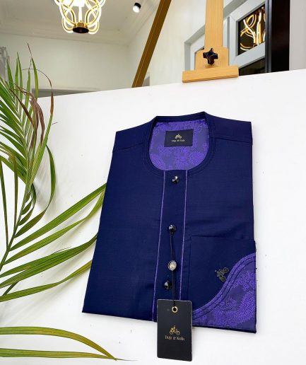 A Navy blue front flap with a clear view of Swarovski crystal buttons, short-sleeve African kaftan