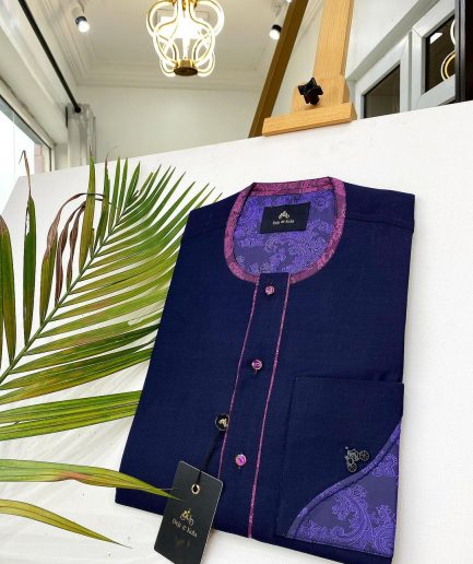 A Navy blue front flap with a clear view of Swarovski crystal buttons, short-sleeve African kaftan