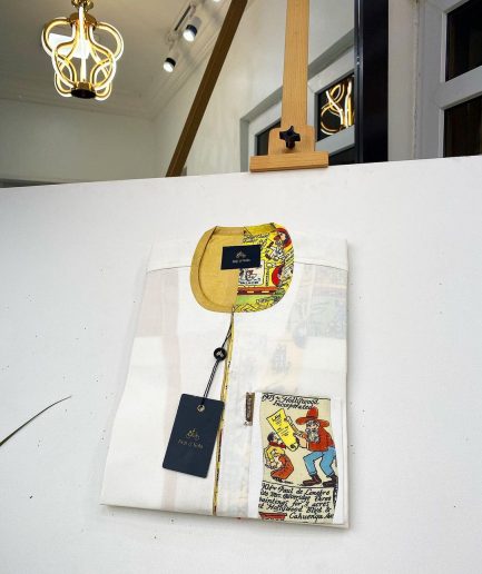 An Ivory white front flap with a clear view Swarovski crystal button, short-sleeve African kaftan