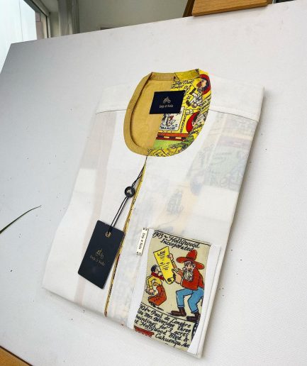 An Ivory white front flap with a clear view Swarovski crystal button, short-sleeve African kaftan