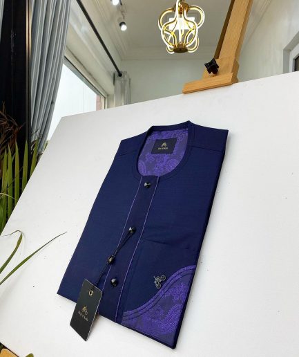 A Navy blue front flap with a clear view of the Swarovski and purple paisley African kaftan