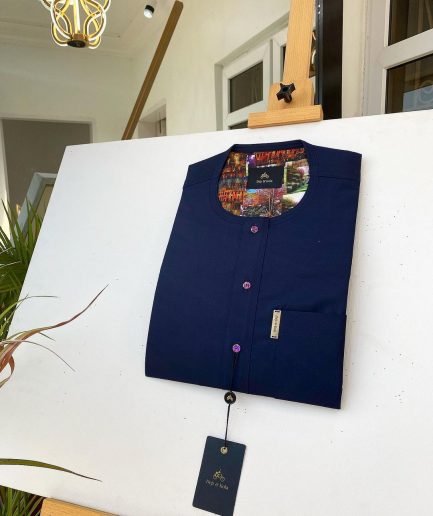 A Navy blue kaftan with purple paisley detailing, matching Swarovski button and sokoto