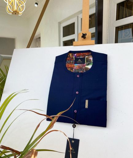 A Navy blue kaftan with purple paisley detailing, matching Swarovski button and sokoto