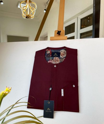 A Burgundy with a clear Swarovski button front flap African Kaftan