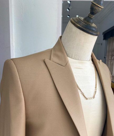 The “Diego Maradona” monochrome Champagne Gold peak lapel business suit