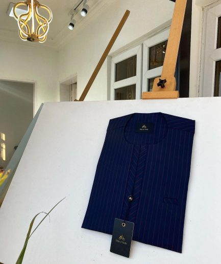 A blue and red stripe kaftan, interlocking neck piping