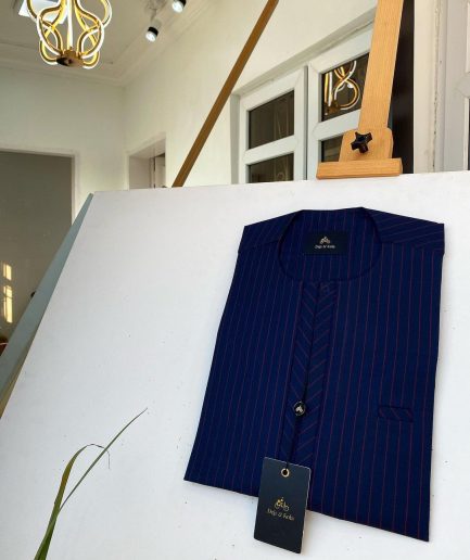 A blue and red stripe kaftan, interlocking neck piping