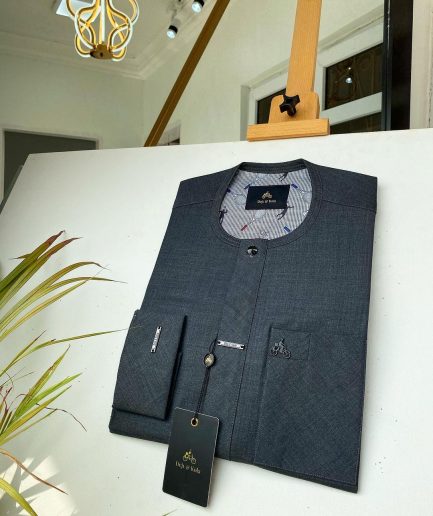 An Irish Grey African kaftan with a black Swarovski button and metal detailing