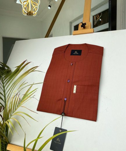 A black stripe and burnt orange African kaftan with gold buttons detailing and sokoto