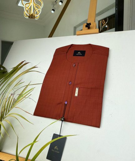 A black stripe and burnt orange African kaftan with gold buttons detailing and sokoto