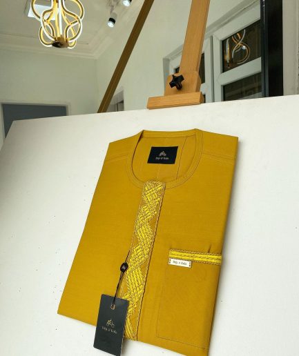 A Mustard Yellow Embroidery African kaftan with an interlocking lane design and sokoto