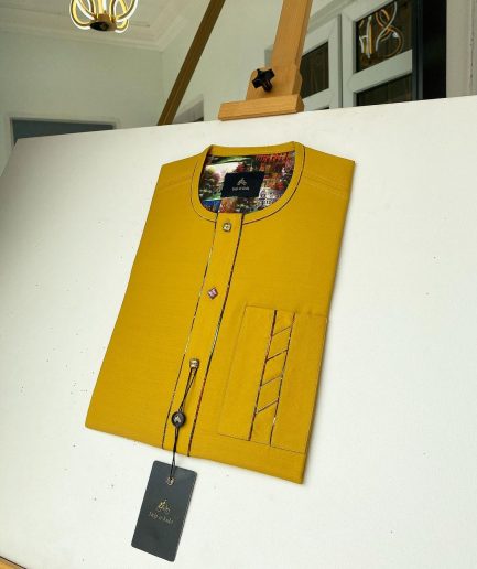 A Mustard Yellow with an interlocking lane design square-shaped buttons African kaftan