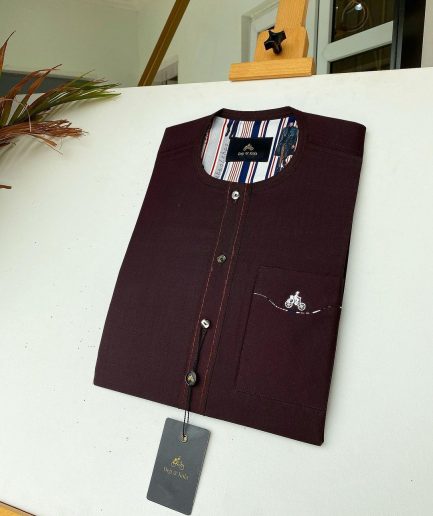 A burgundy with Swarovski button details African kaftan