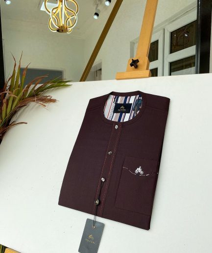 A burgundy with Swarovski button details African kaftan