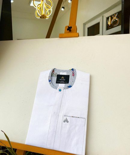 A Snow White with a touch of blue front flap African Kaftan