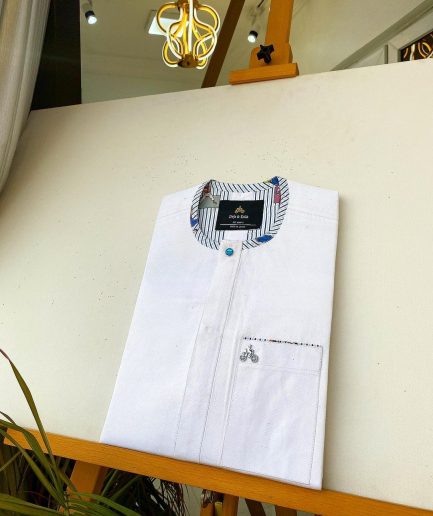 A Snow White with a touch of blue front flap African Kaftan