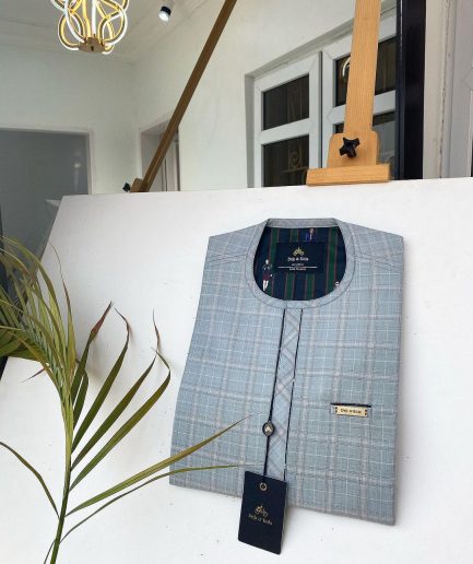 A Prince Charles check fabric kaftan with a cornerpiece flap design