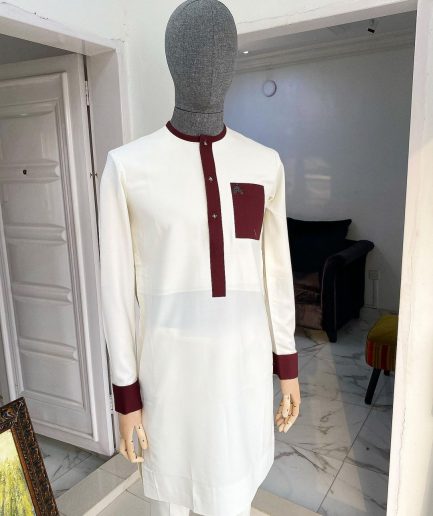 An Ivory white kaftan with a burgundy mix flap, pocket, and cuff design African Kaftan