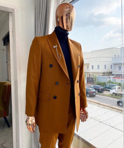A Burnt Orange Double Breasted Peak Lapel Suit.