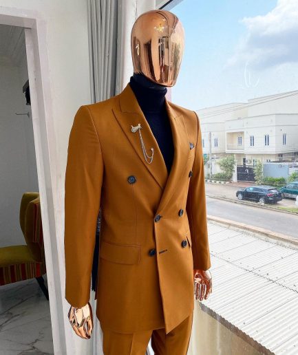 A Burnt Orange Double Breasted Peak Lapel Suit.