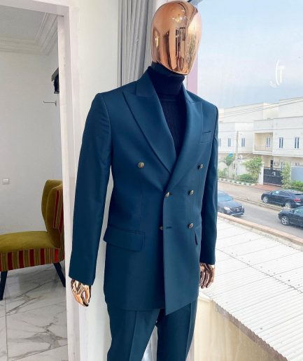 An Army green double-breasted peak lapel suit