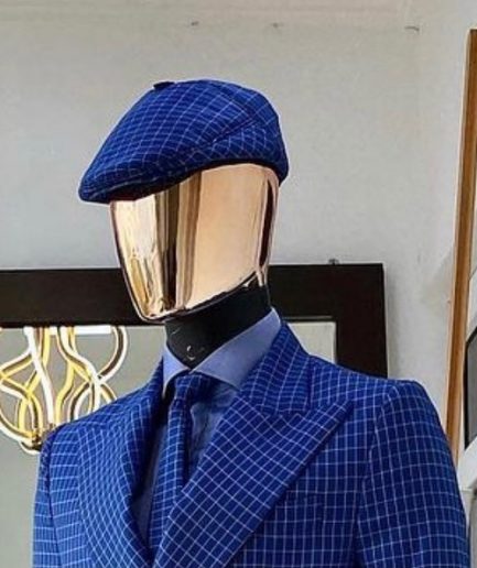 A Skye blue and white check men’s Kangol papas hat.