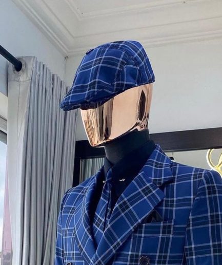 A Windowpane Check Men’s Kangol Papas Hat.