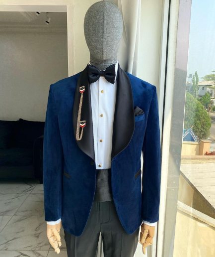 A Navy Blue Velvet Dinner Shawl Lapel Tuxedo Suit.