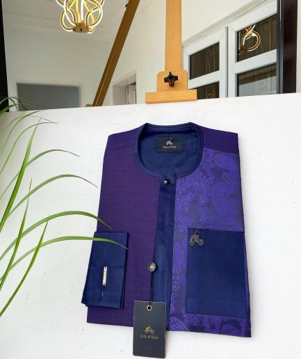 A dark purple matching paisley left section, and a silk blue flap and pocket with a Swarovski African Kaftan