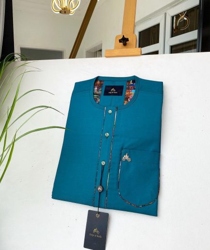 An emerald green with a Swarovski stone button and lower cylinder-shaped African Kaftan