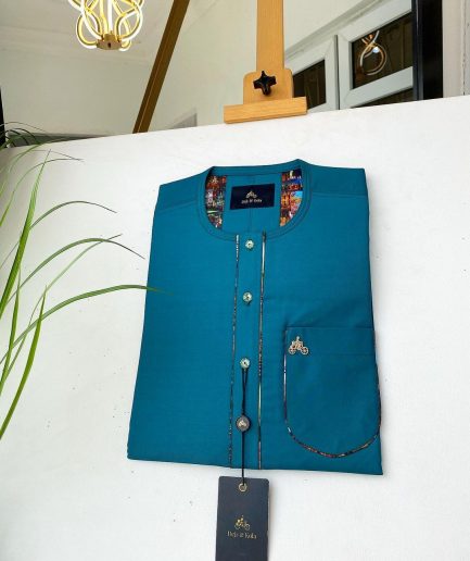 An emerald green with a Swarovski stone button and lower cylinder-shaped African Kaftan