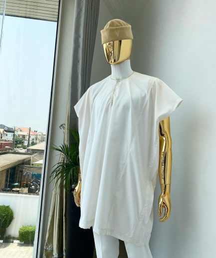 A Hand picked (jakan design) ivory white dashiki buba, sokoto & a cream patterned wool hat.