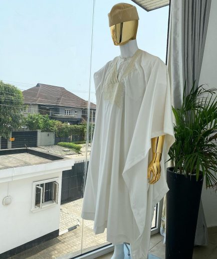 A “jakan” hand woven embroidery agbada, dashiki, sokoto with a cream wool patterned hat.