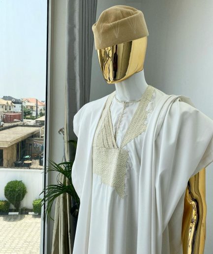 A “jakan” hand woven embroidery agbada, dashiki, sokoto with a cream wool patterned hat.